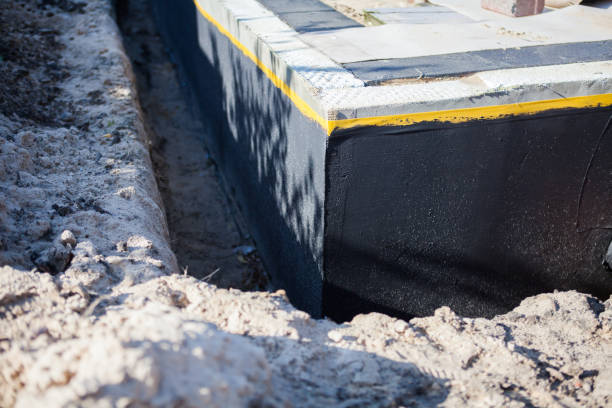 Professional Waterproofing technician working in Mosherville, MI